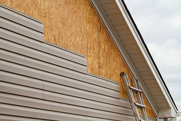 Professional Vinyl Siding technician working in East Rockaway, NY
